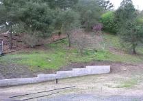 Hillside Concrete Retaining Wall & Drainage Control